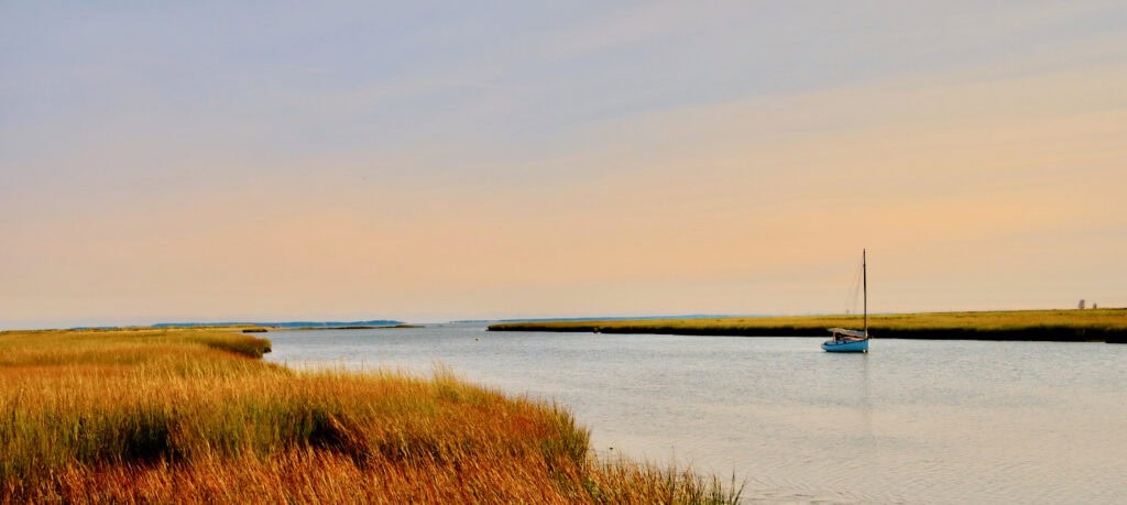 Smith Neck Road Old Lime with single sailboat at anchor