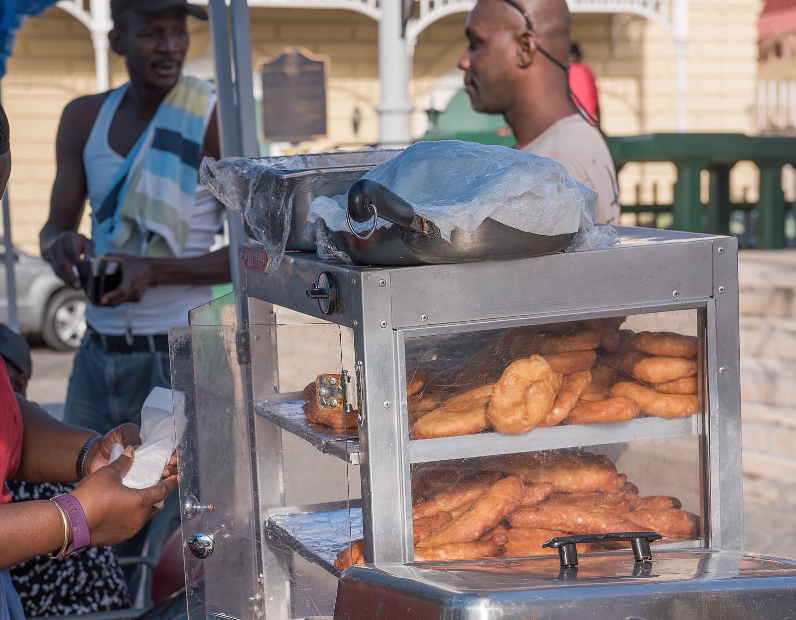 Vendor selling Salt Fish Pates on St. Croix.