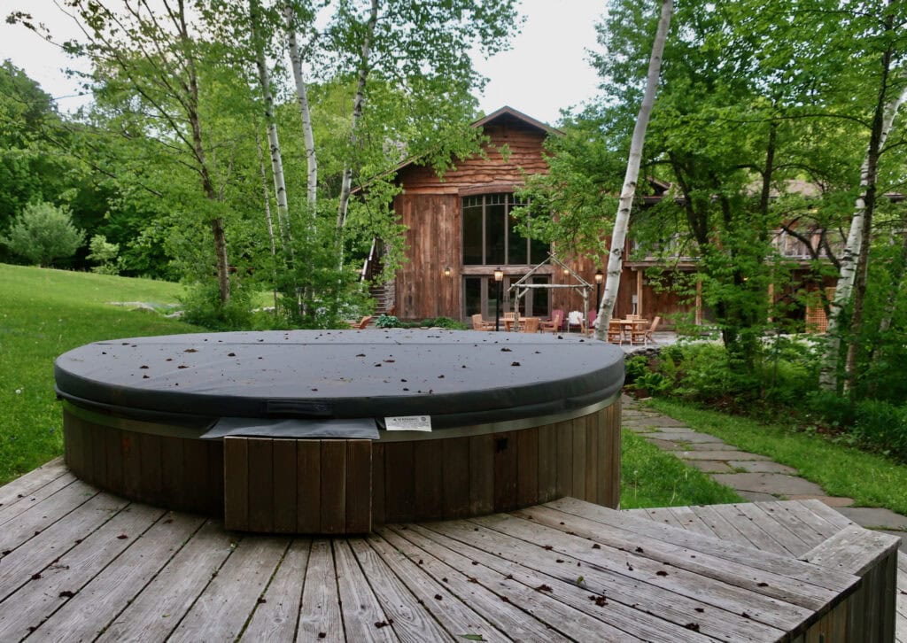 Private hot tub outside of Seesaw's Lodge Main Lodge building Peru VT