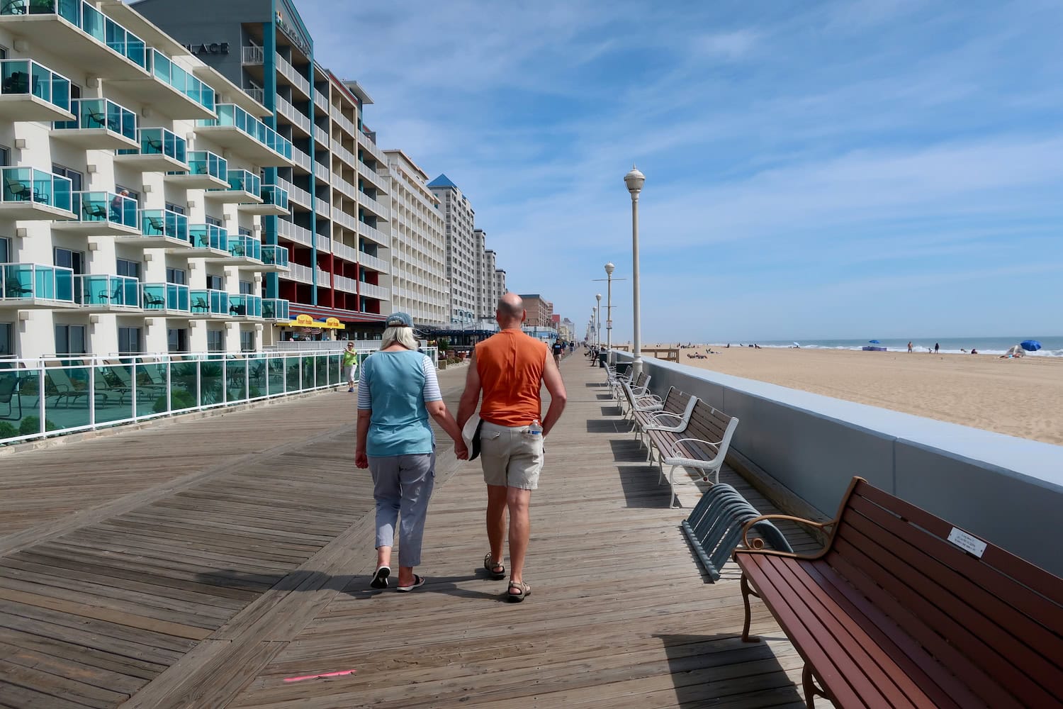 Couple holding hands on the Ocean City MD boardwalk