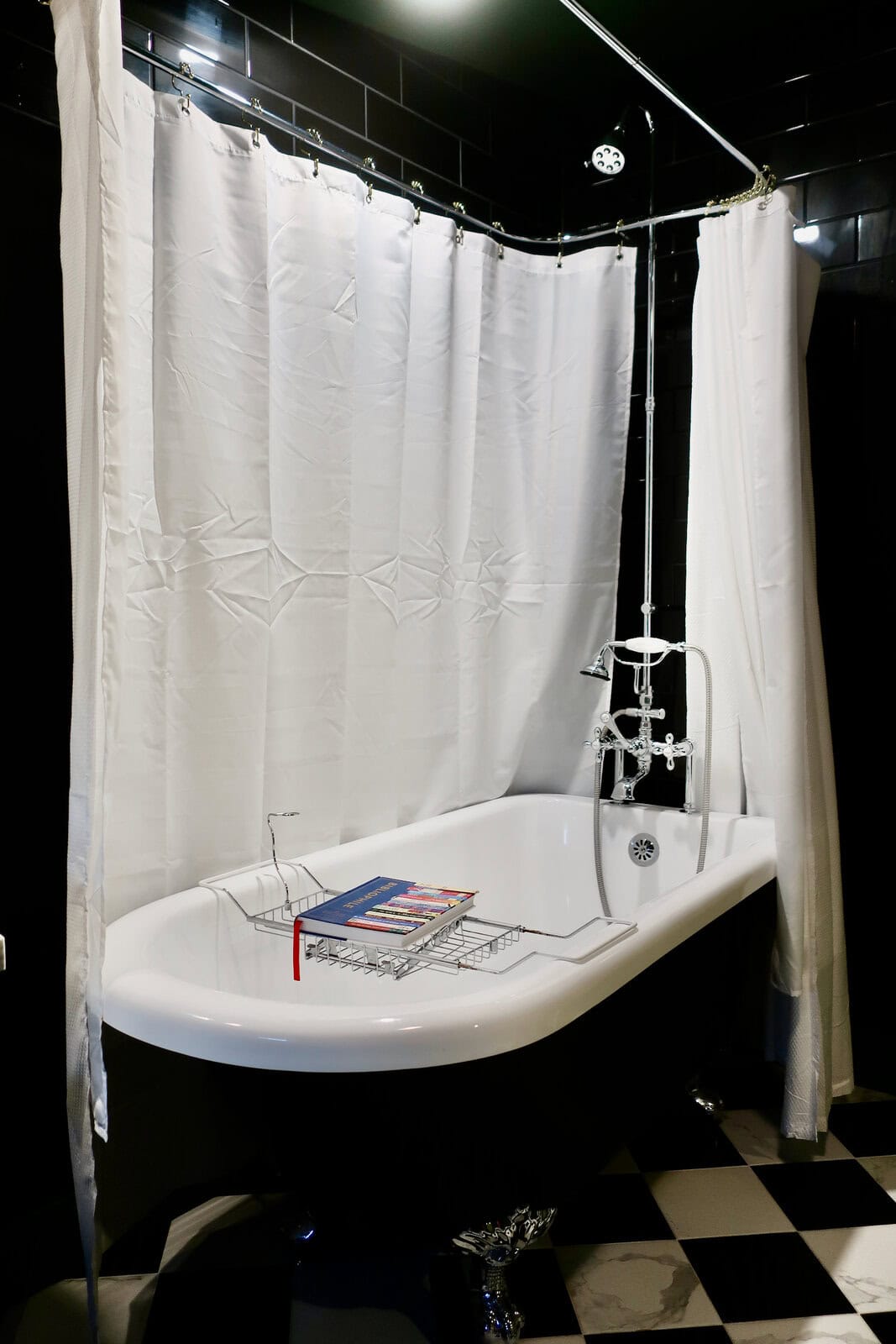 Black and silver clawfoot tub  at The Bookhouse Hotel Kennett Square
