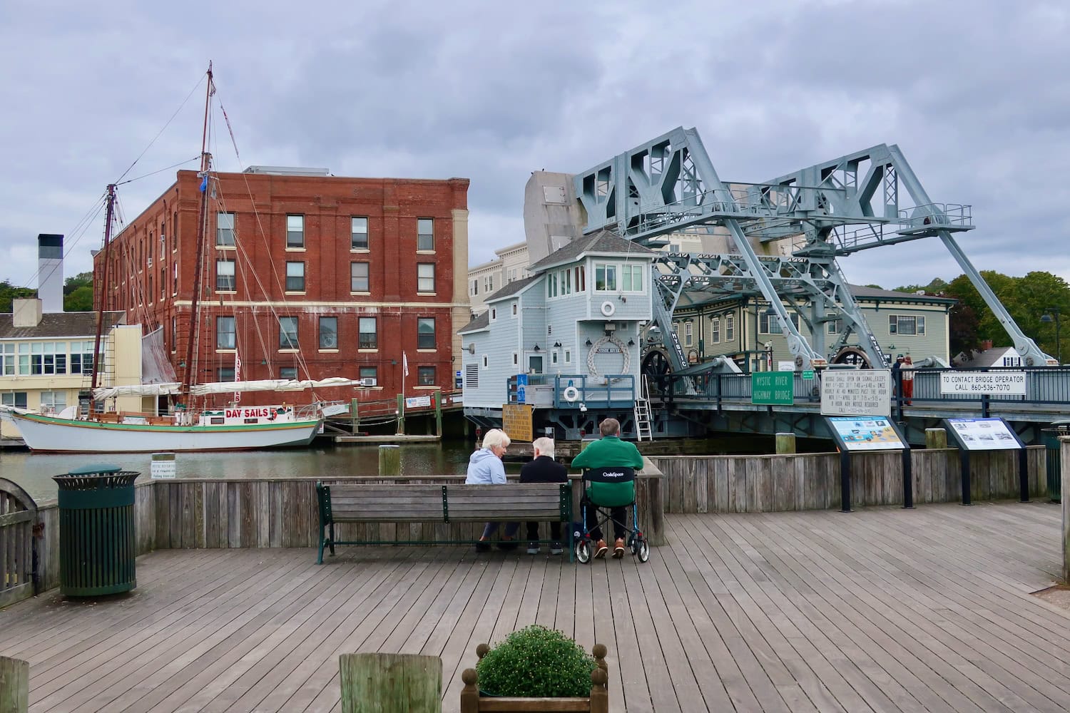 Mystic CT couple overlooking river and drawbridge