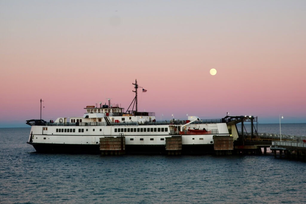 Steamship Authority ferry at Oak Bluffs dock at night - wtih moon