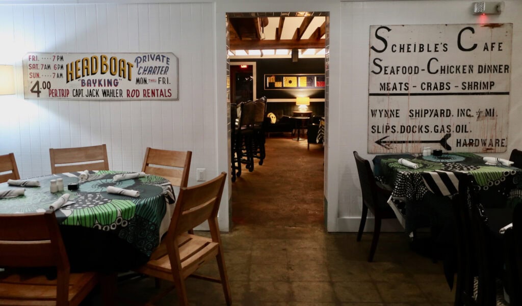 Pier450 restaurant and entrance to bar with advertisement boards from former Scheible's Fish Camp